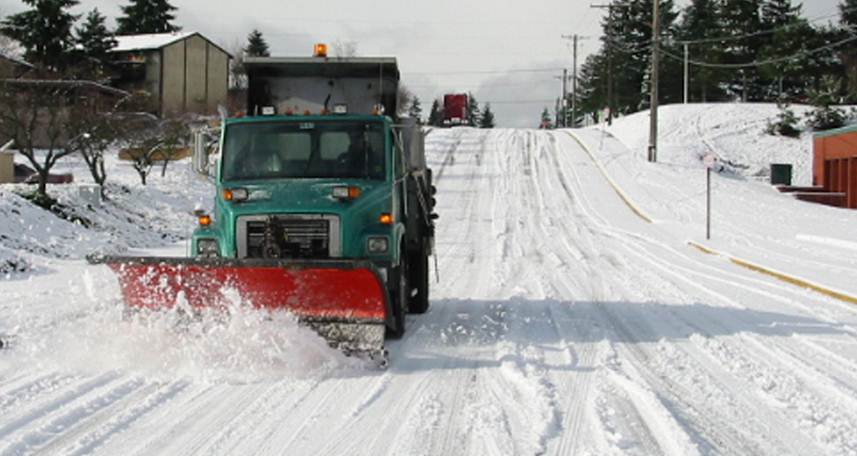 Image of snow plow on clearing snow from the streets in Tacoma