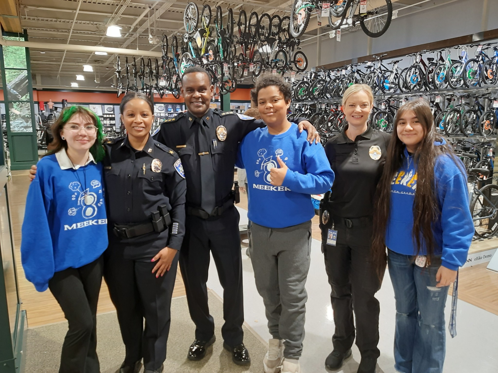 Photo of Chief Avery Moore with Assistant Chief Young-Haskins and at the Shop With A Cop event at Dick's Sporting Goods
