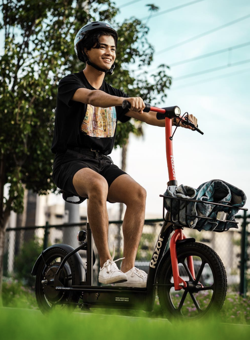 photo of man on scooter